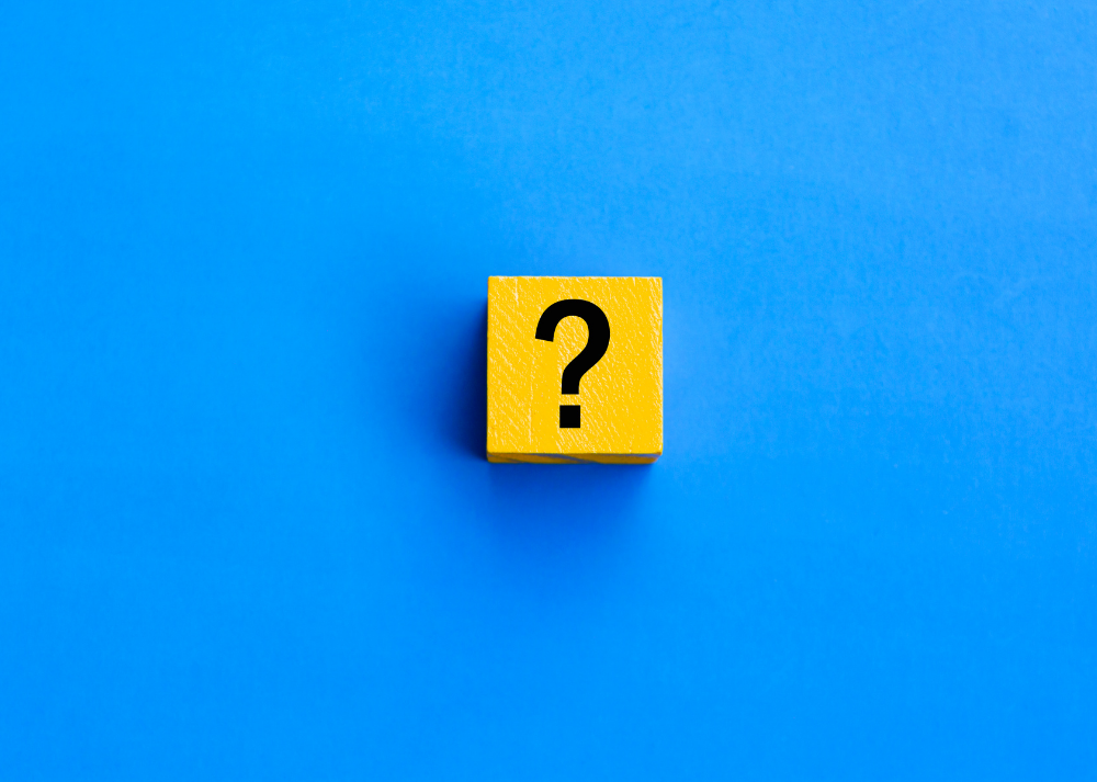 question mark on yellow box sitting on blue background